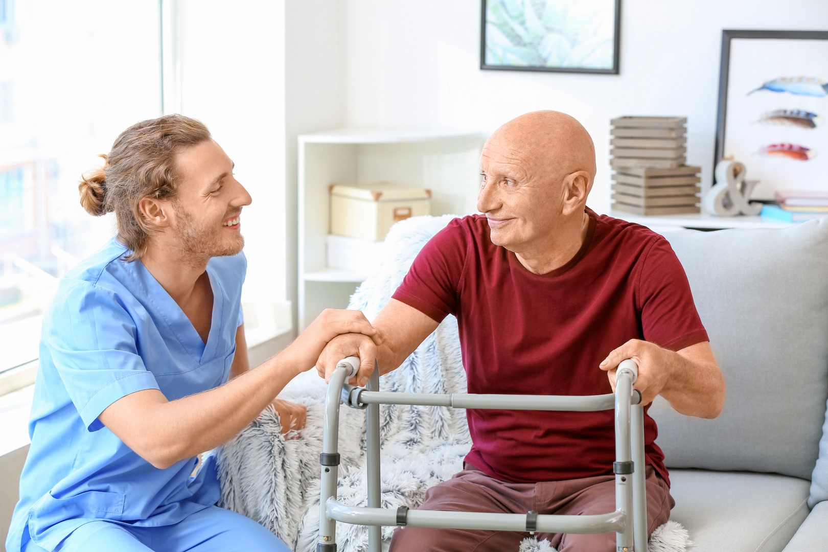 Elderly man with caregiver in nursing home