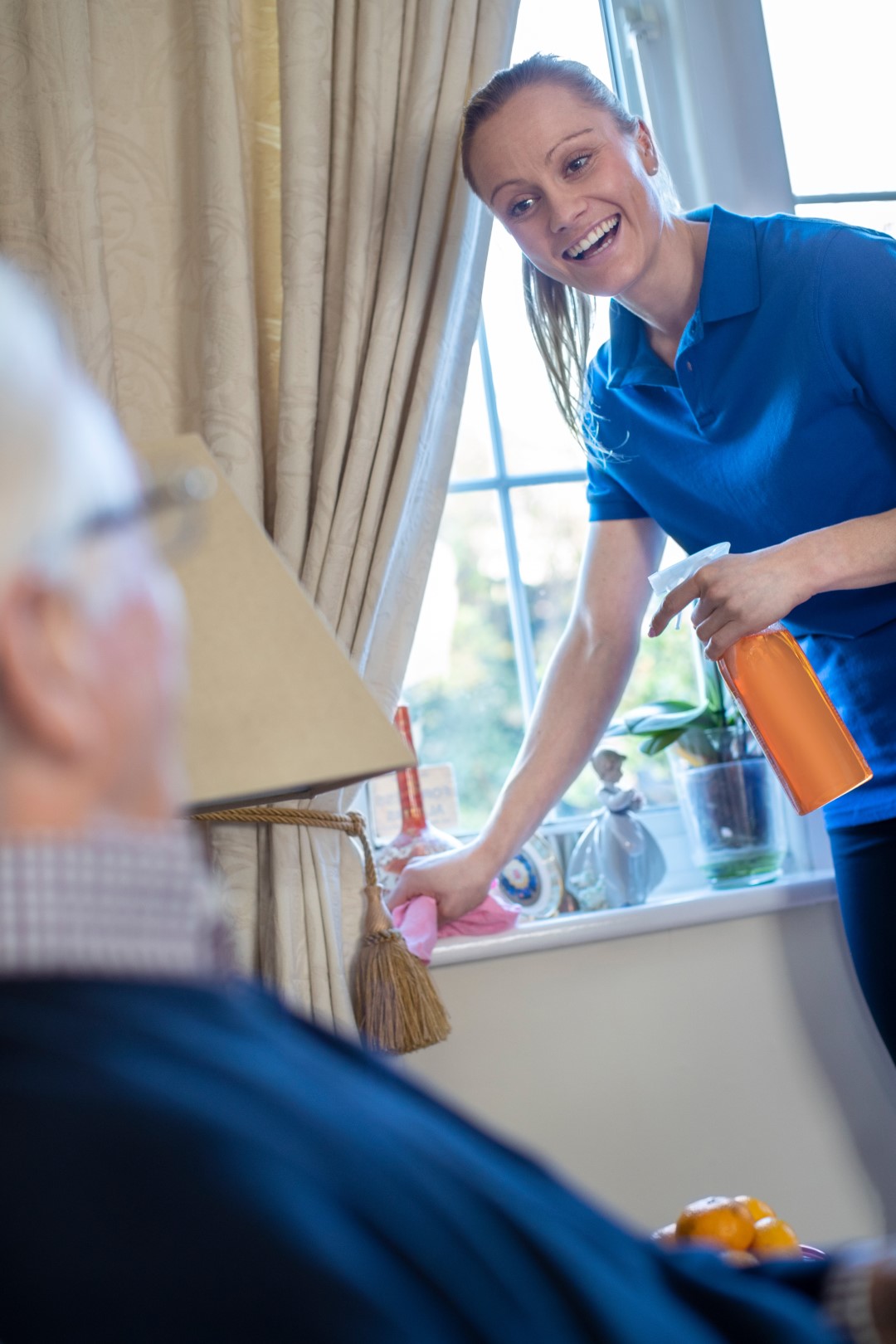 Female Home Help Cleaning House For Senior Man